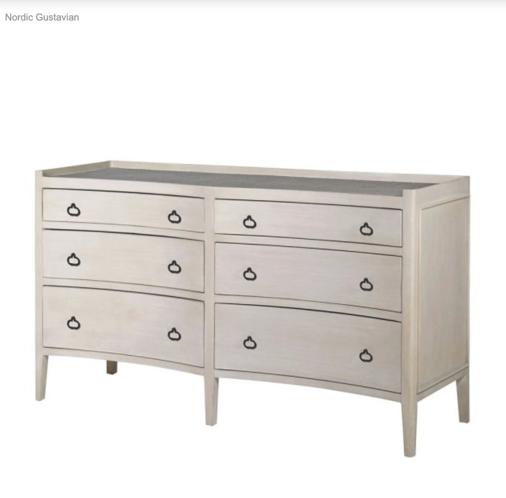 Light gray dresser with black handles on a white background