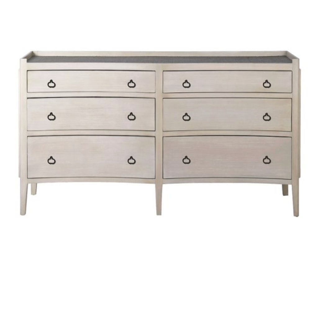 White dresser with black handles on a white background