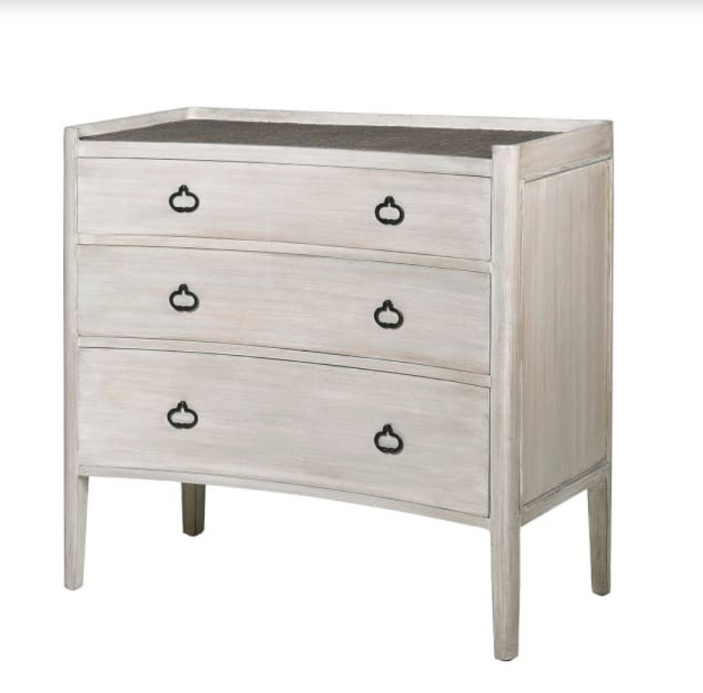 White dresser with black handles on a white background