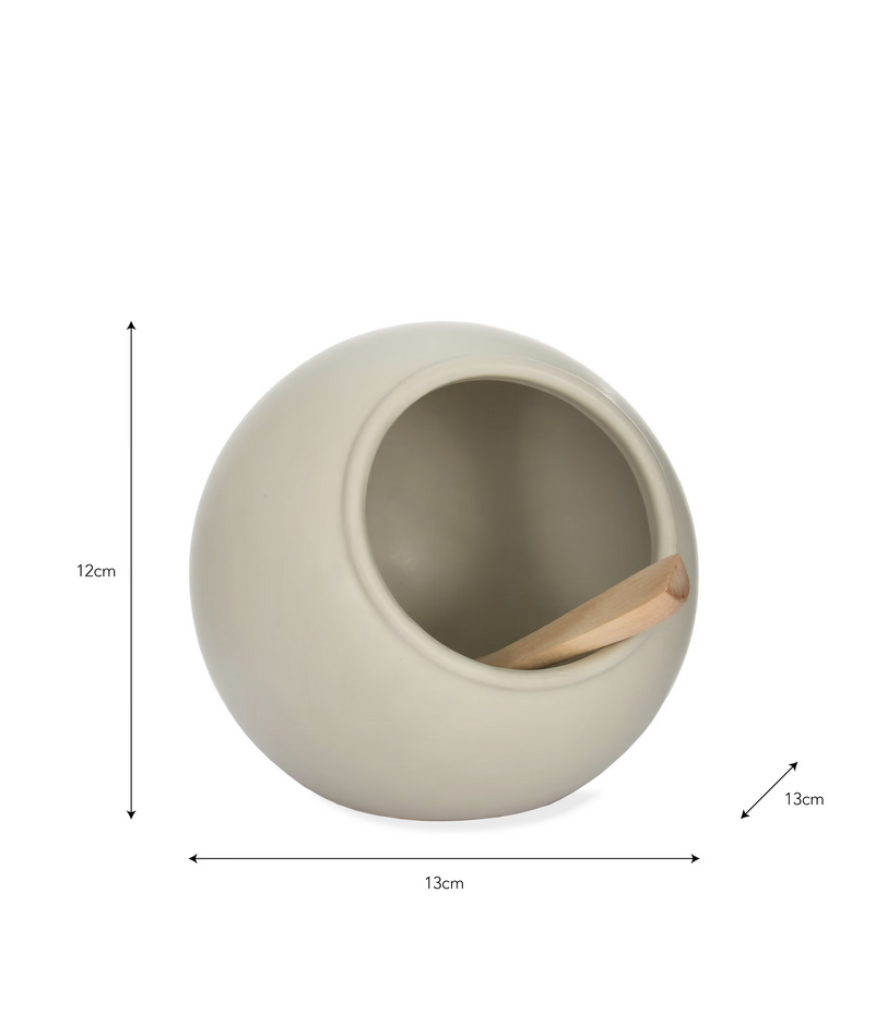 Beige ceramic planter with wooden tool on a white background