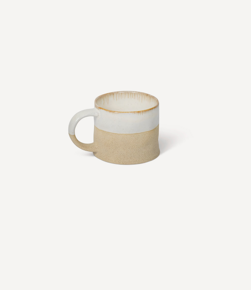 Ceramic mug with two-tone design on a white background