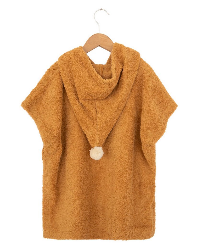 Brown hooded towel with pom-pom on a wooden hanger against a white background