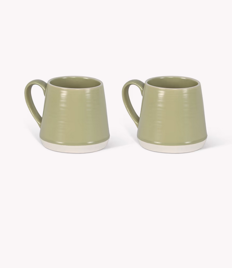 Two green ceramic mugs on a white background