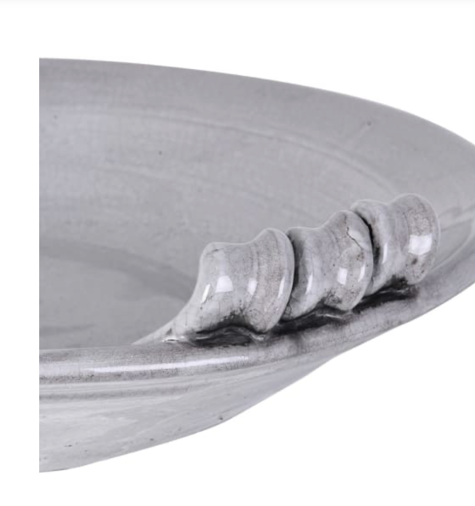 Close-up of a metallic object with a textured surface on a white background