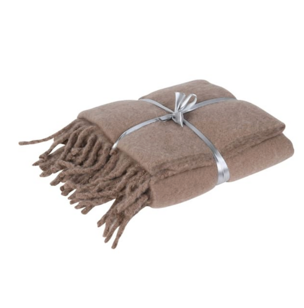 Brown blanket with tassels and a silver ribbon on a white background